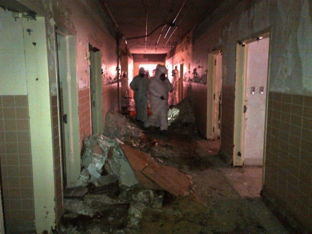 Asbestos removal from an old building prior to demolition.