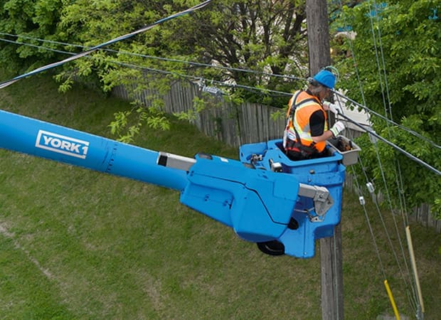Blue Bucket Truck with Utility Worker